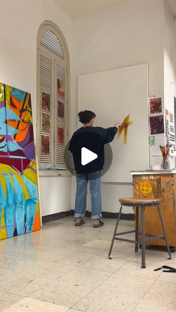 Mia painting in the studio