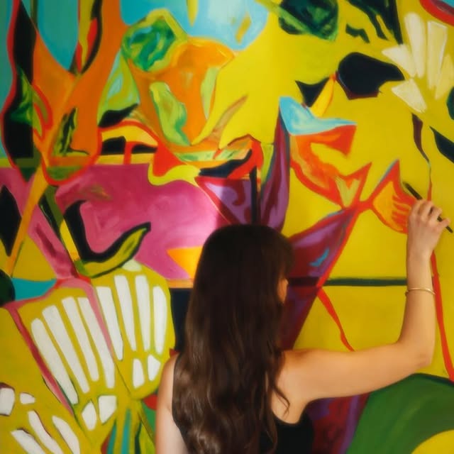 Mia working on a painting closeup